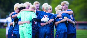 Greeley's Boys Team in a huddle during the game.