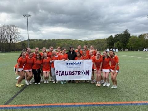 Greeley Girls Lacrosse Team with banner